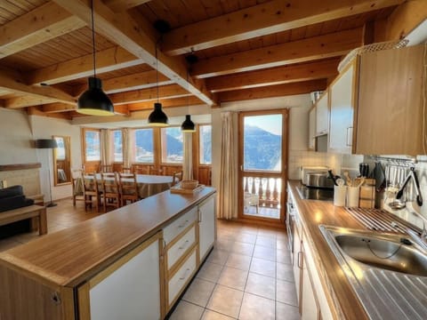 Fully equipped kitchen with balcony access and stunning views