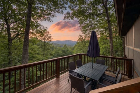 Dine al fresco on the spacious deck with seating for six, surrounded by mountain views and towering forest. The perfect spot to enjoy meals, sunsets, and fresh mountain air.