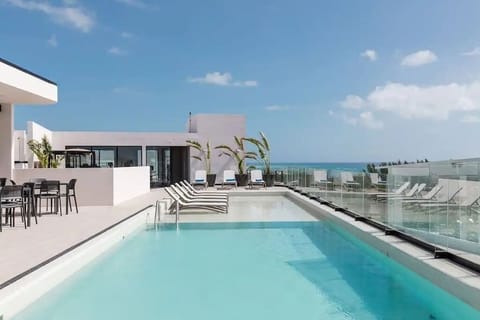 Shared rooftop pool with ocean view