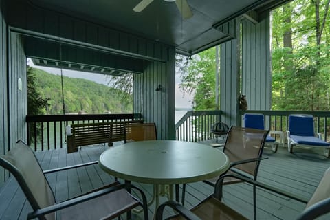 Open air covered porch on bottom floor leading out to the lake