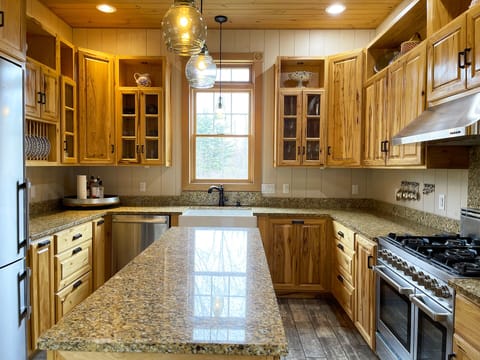 The kitchen has 9 foot custom cabinets hand made by a local artisan.