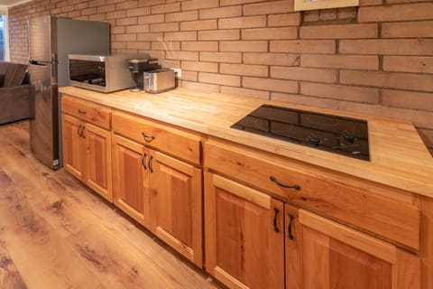 Kitchenette - cooktop, toaster, coffee machine, microwave, fridge