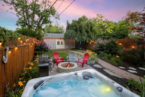 Relax in the hot tub and enjoy the serene back yard