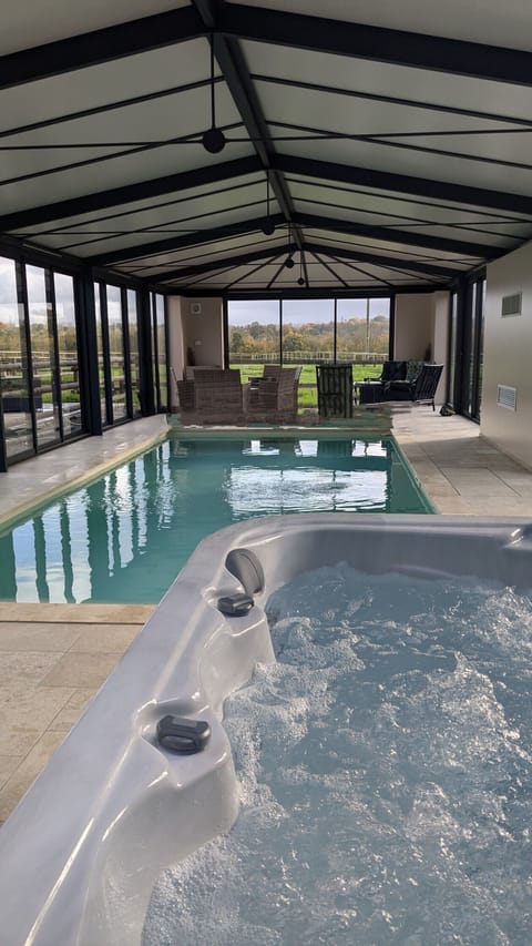 Indoor pool, a heated pool, sun loungers