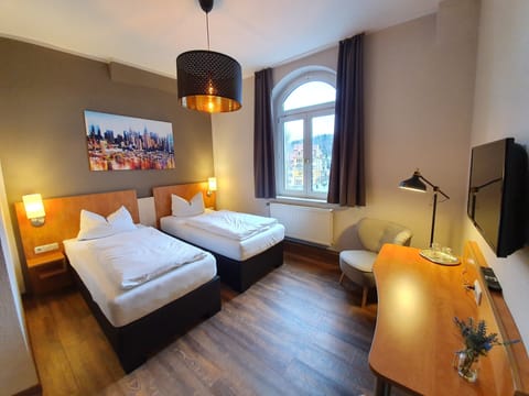 Desk, laptop workspace, free WiFi, bed sheets