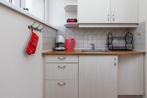 Prepare meals with ease in the kitchen's functional layout.