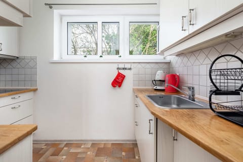 The kitchen's stylish decor complements the apartment's overall design.