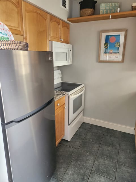 New stainless refrigerator, oven and microwave