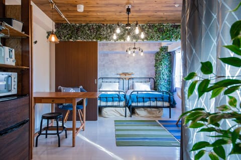 Double or Twin Room | Living area | Flat-screen TV