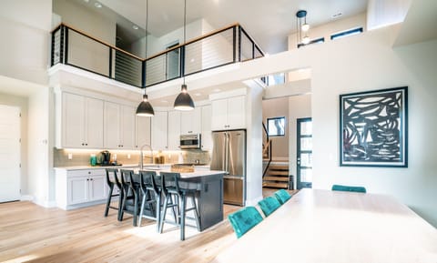 Brand new modern space with vaulted ceilings, Viking appliances, and curated artwork. 