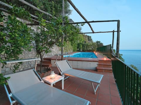 Property, Furniture, Water, Plant, Sky, Outdoor Furniture, Wood, Shade, Chair, Cottage