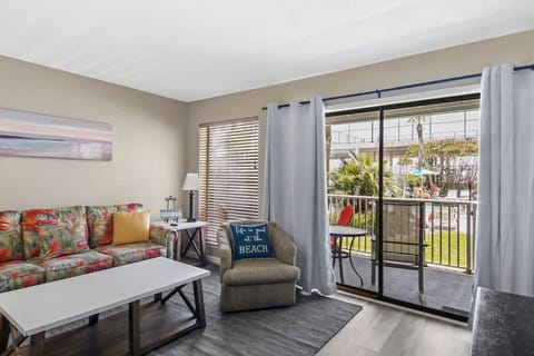 Living room with sofa bed and view of patio