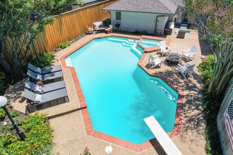 Fully fenced private yard with a giant pool (can be heated for an extra fee), and 8-person spa, loungers, and multiple sit down areas. Please note the diving board was removed recently. 