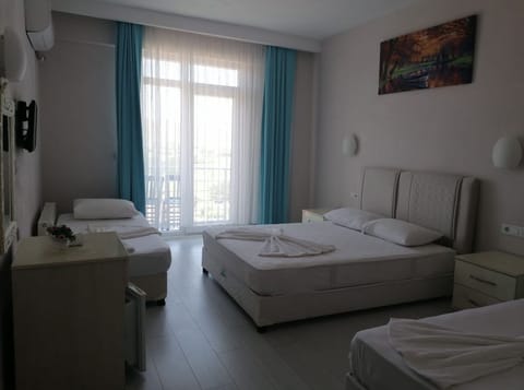 Family Triple Room, Sea View | Bed sheets