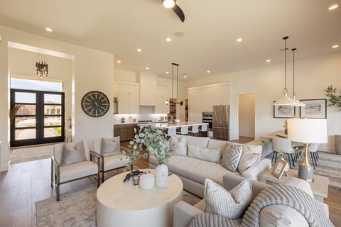 Living Room - The living room is designed as an open floor plan and is a great gathering place for meals, games, or watching TV during your stay.
