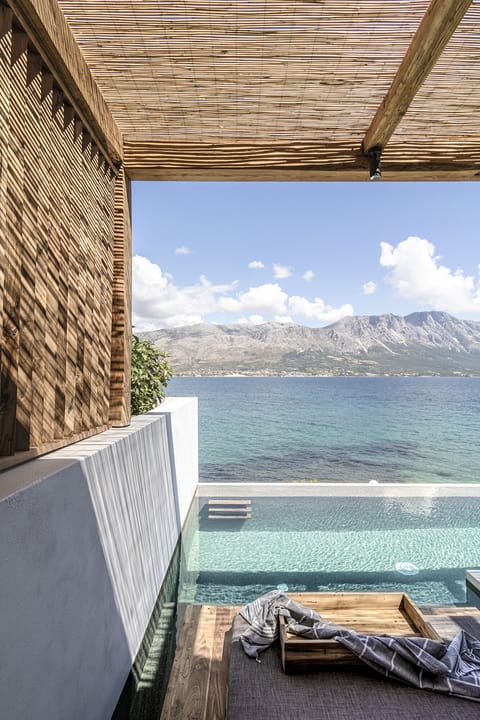 Special Offer - Seafront Suite | Living area | 50-inch Smart TV with digital channels, TV