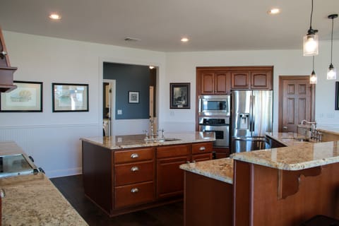 Kitchen (center is hallway with laundry and half bath)
