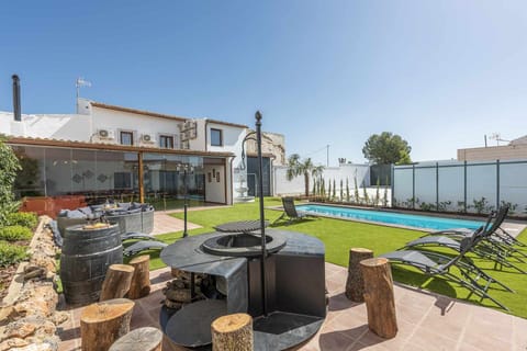 Property building,BBQ facilities,Garden,Pool view,Swimming pool
