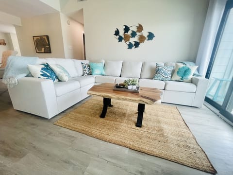 Relax with light colors, custom cherry furniture, and beautiful waterfront views