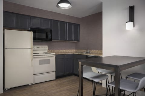 Suite, 2 Bedrooms | Private kitchen | Fridge, microwave, stovetop, dishwasher