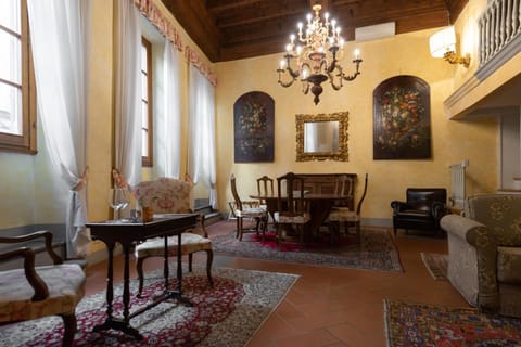 Deluxe Duplex, City View | Living room | Flat-screen TV, printers