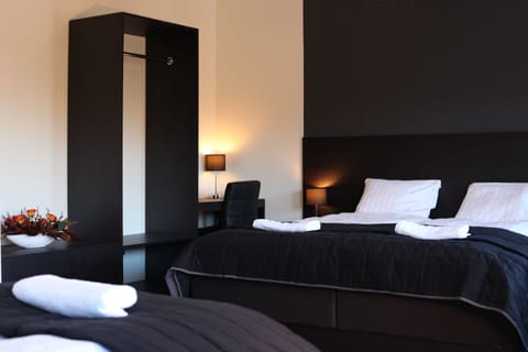 Triple Room | Desk, blackout drapes, iron/ironing board, free WiFi