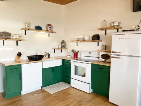 The newly remodeled kitchen is fully stocked for you.