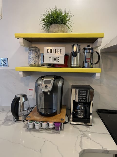 Coffee Bar fully equipped with: Keurig machine, coffee drip machine, Bean Grinder, french press coffee maker, and starter supply of k-cups!