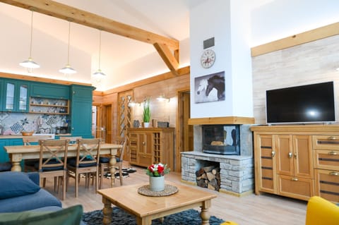 Deluxe Chalet, 3 Bedrooms, Sauna, Mountain View | Living area | 100-cm TV with satellite channels, fireplace