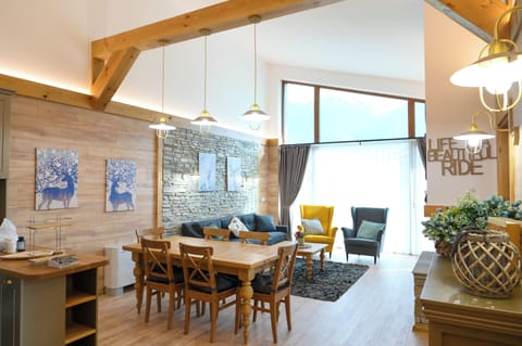 Deluxe Chalet, 3 Bedrooms, Sauna, Mountain View | Living area | 100-cm TV with satellite channels, fireplace