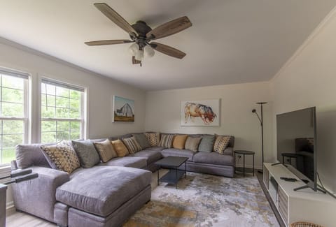 Huge sectional sofa in family room with 65” 4K TV