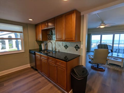 Full size kitchen, dishwasher, cup, plate, etc...