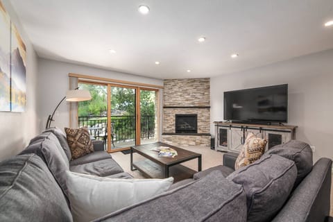 Cozy living room with fireplace and ample seating—ideal for relaxing or gathering with friends and family!