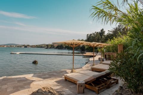 On the beach, free beach shuttle, sun loungers, beach umbrellas