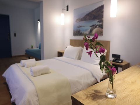 Family Quadruple Room, Patio, Courtyard View | Egyptian cotton sheets, premium bedding, down comforters
