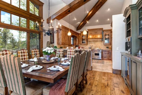     Spacious dining area with rustic charm, natural light, and warmth.