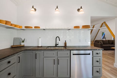 Fully, stocked and updated kitchen featuring marble countertops.