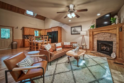 Living room with gas fireplace to stay warm and cozy. Couch has been replaced.