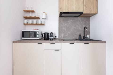 The fully equipped kitchenette includes everything you need for a home-cooked meal.