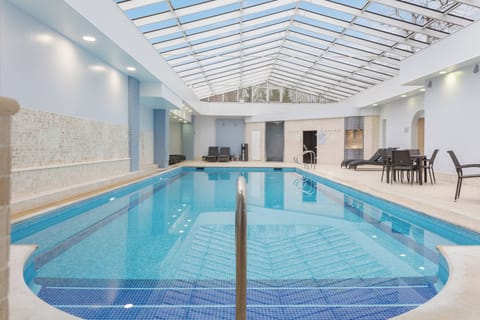Indoor pool, open 8:00 AM to 7:00 PM, sun loungers