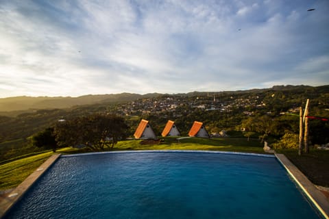 Outdoor pool, open 9:00 AM to 9:00 PM, pool umbrellas