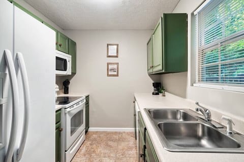 The kitchen has all the appliances you need!  Full with all the essentials and a fridge, microwave, oven, dishwasher, coffee machine and toaster.