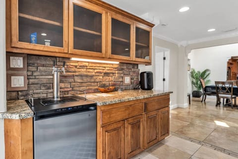 Built-in wet bar with beverage fridge—perfect for entertaining, game nights, or evening drinks after sunset kayaking.