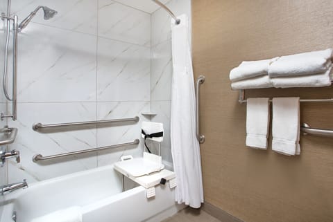 Combined shower/tub, designer toiletries, hair dryer, towels