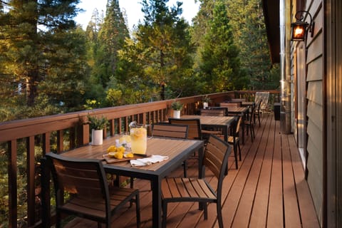 Dine amongst the tree tops in small groups or join tables to host a party of 12