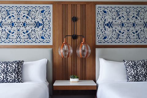 Premium bedding, desk, iron/ironing board, free cribs/infant beds