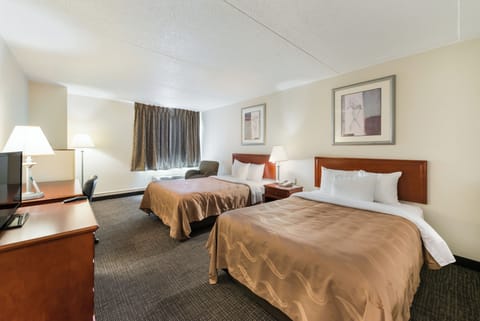 Suite, Multiple Beds, Non Smoking | Desk, laptop workspace, blackout drapes, iron/ironing board