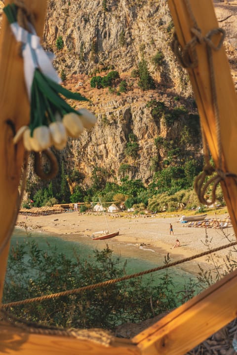 On the beach, white sand, sun loungers, beach umbrellas