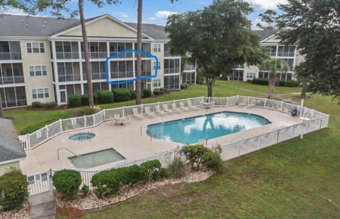 Pool, hottub, & grill area just off the large balcony of this beautiful condo.
