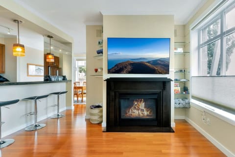 Living Room with TV and Indoor Fireplace